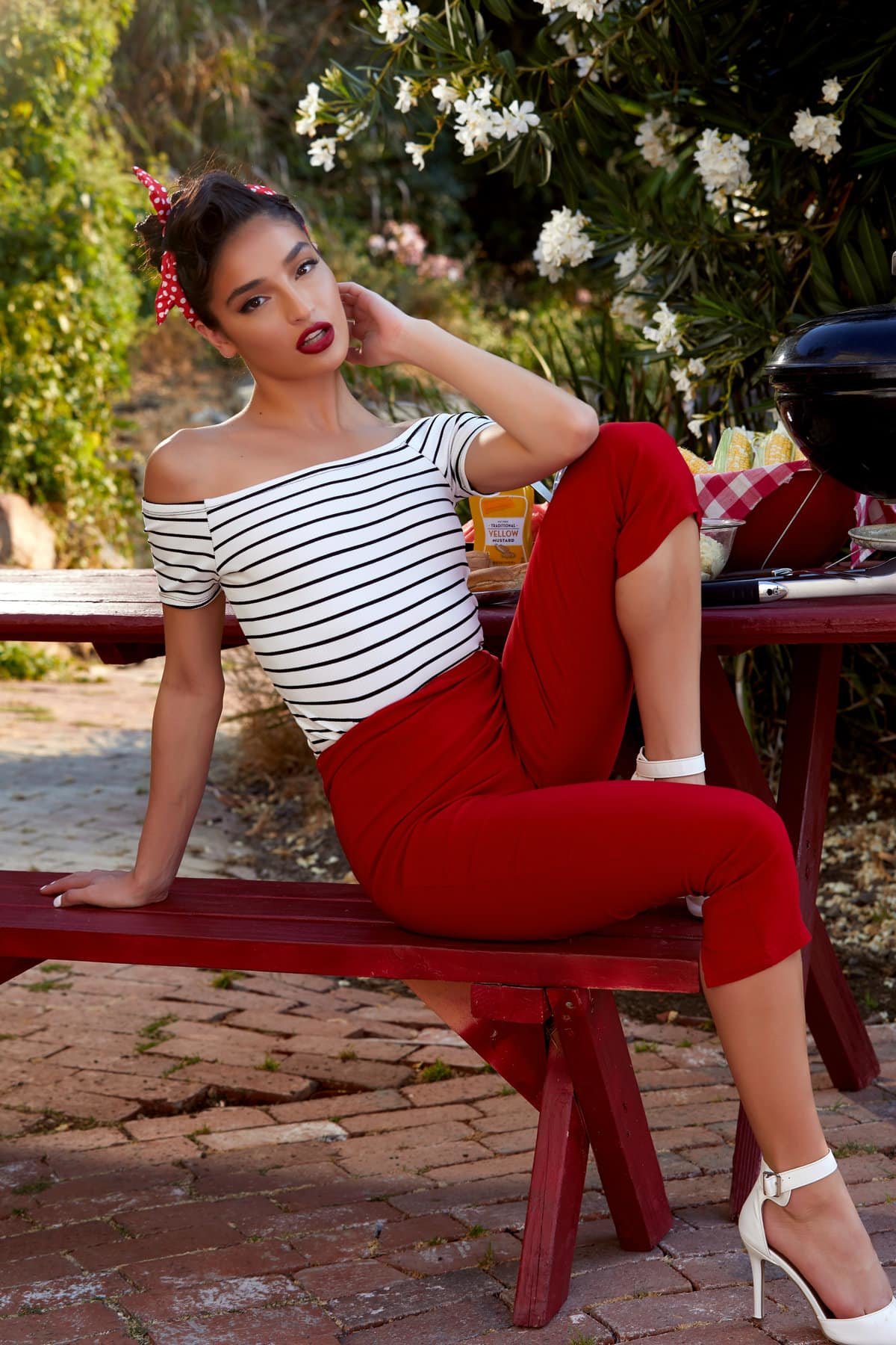 Emily Willis takes off her skin tight red pants in the outdoors