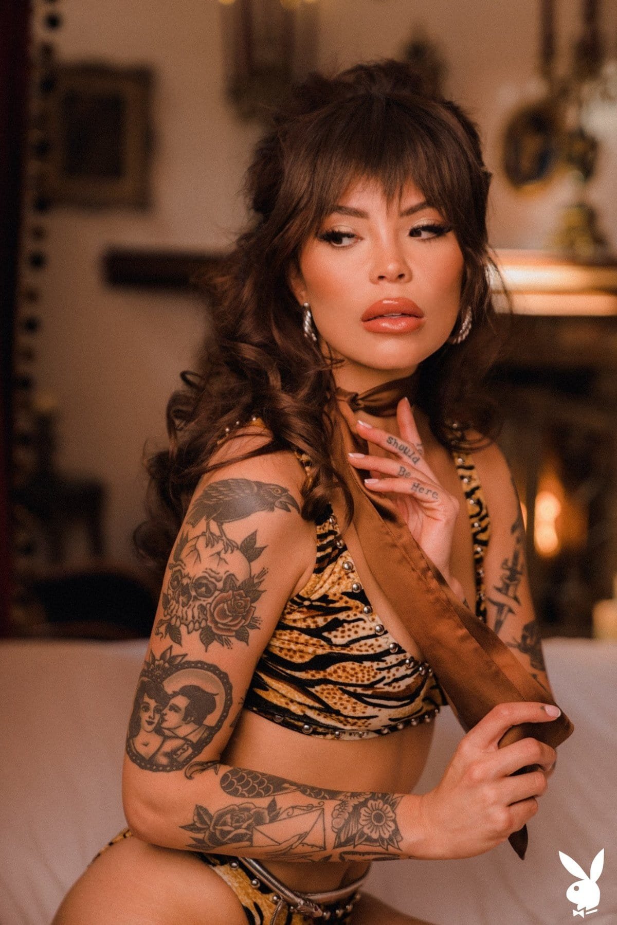 Emma Jade exposes her sexy tattooed body on the sofa