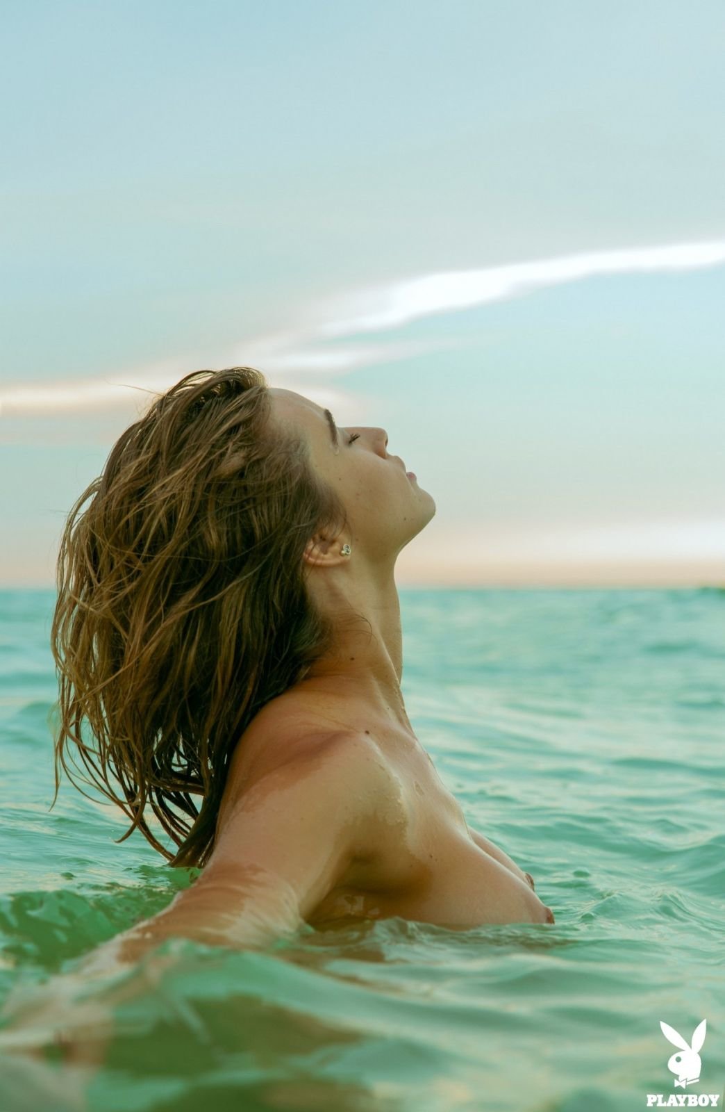 Gabriela Giovanardi takes off her bikini and poses nude on the beach