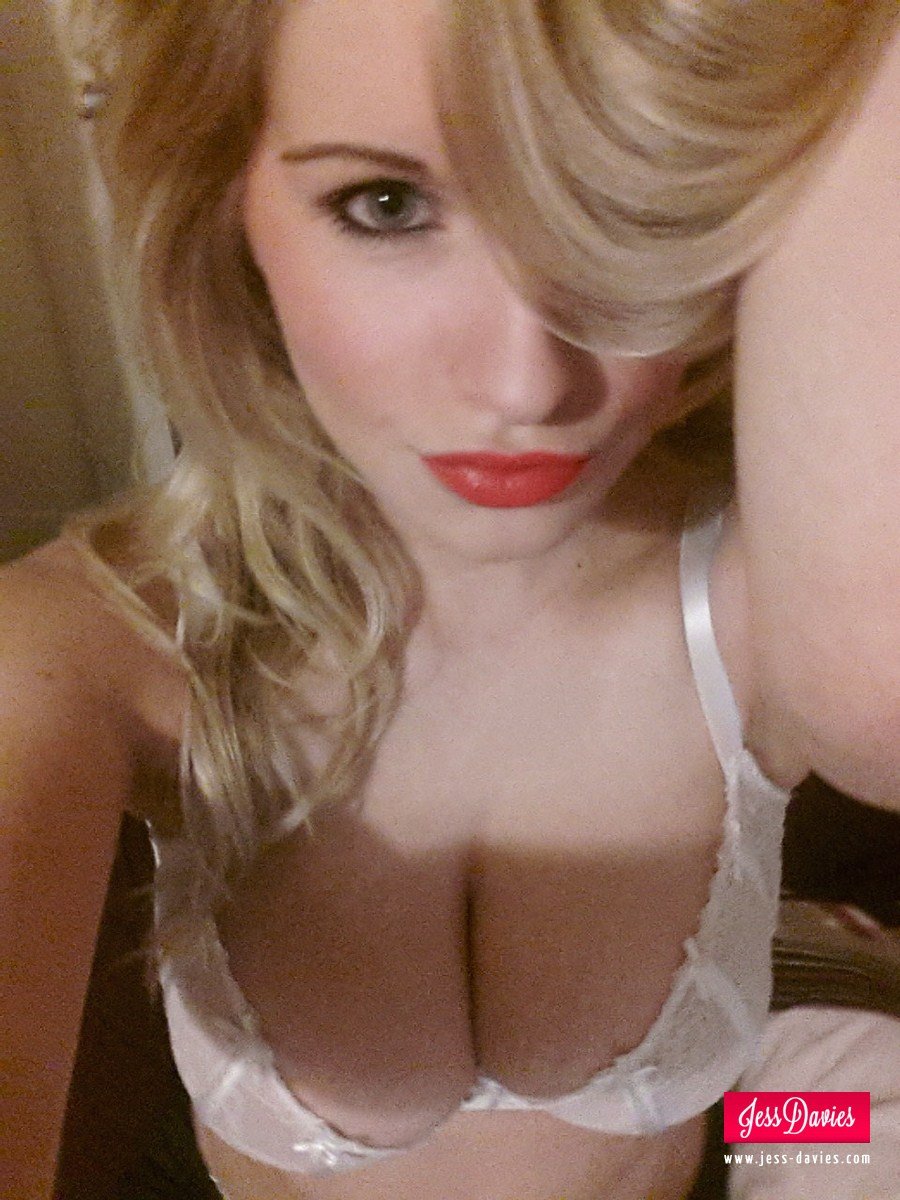 Jess Davies in white bra photographing herself