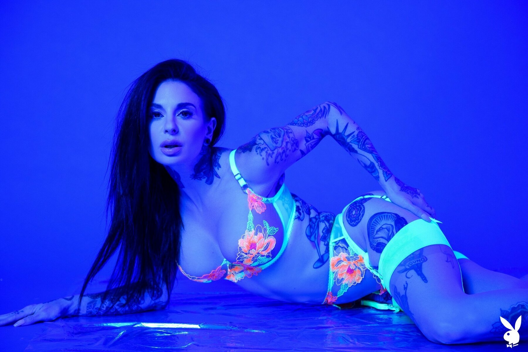 Heavily tattooed Joanna Angel participates in a sexy ultra violet photoshoot