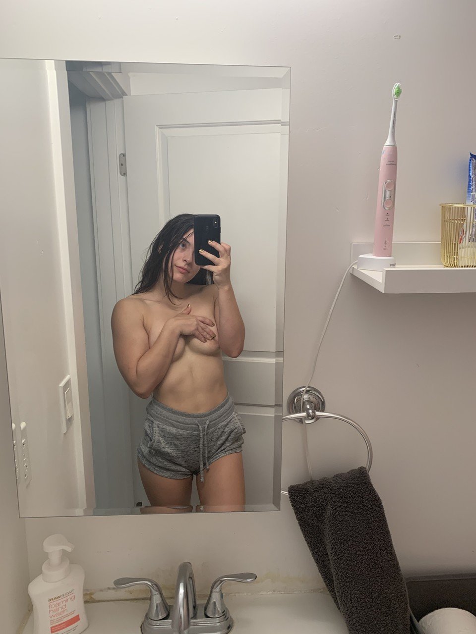 Solo model Abbie Maley takes mirror selfies while getting completely naked
