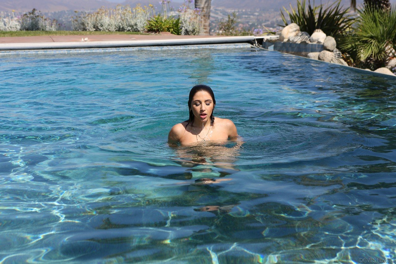 Gorgeous brunette teen Abella Danger showing her naked body by the pool
