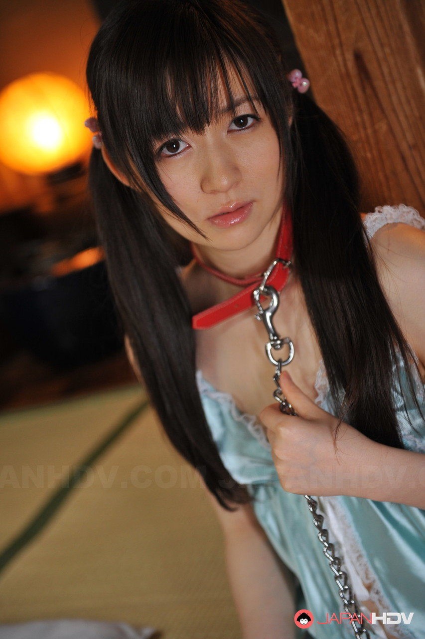 Japanese girl Ai Uehara wears her hair in pigtails in a collar and leash