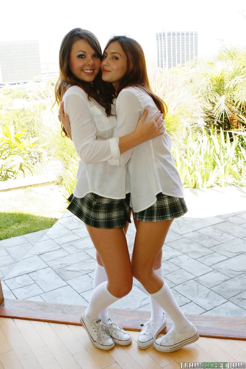 Sexy lesbian students Cali Cassidy & Cassie pose topless in school uniform