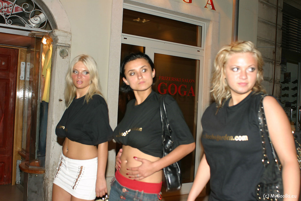 Three girls flash their natural tits while walking a city street at night