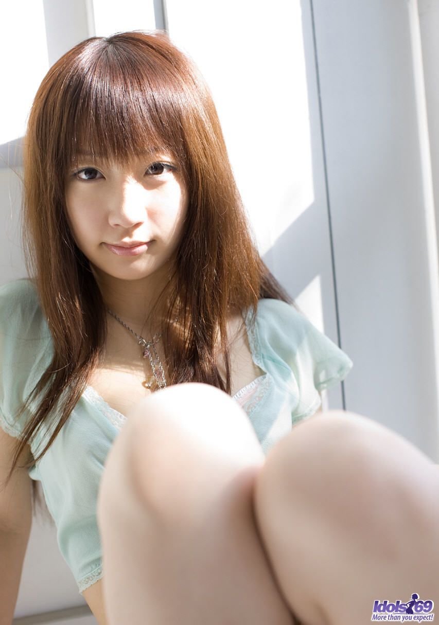 Adorable Japanese teen Hina Kurumi exposes her nice tits during solo action