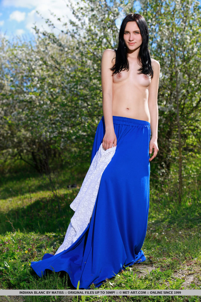 Indiana Blanc strips her long skirt and white blouse baring her slender body