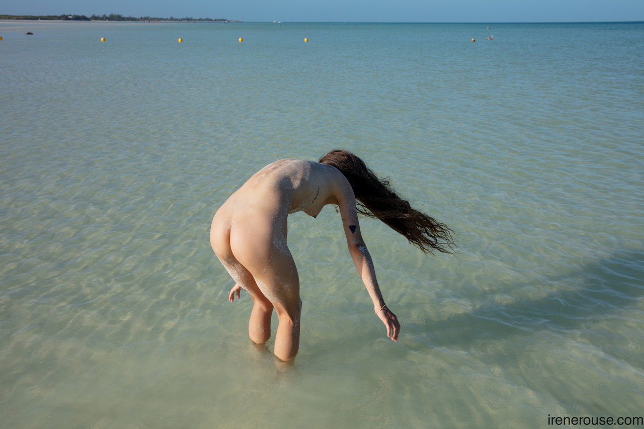 Breathtaking Latina teen Irene Rouse	poses completely naked in the ocean