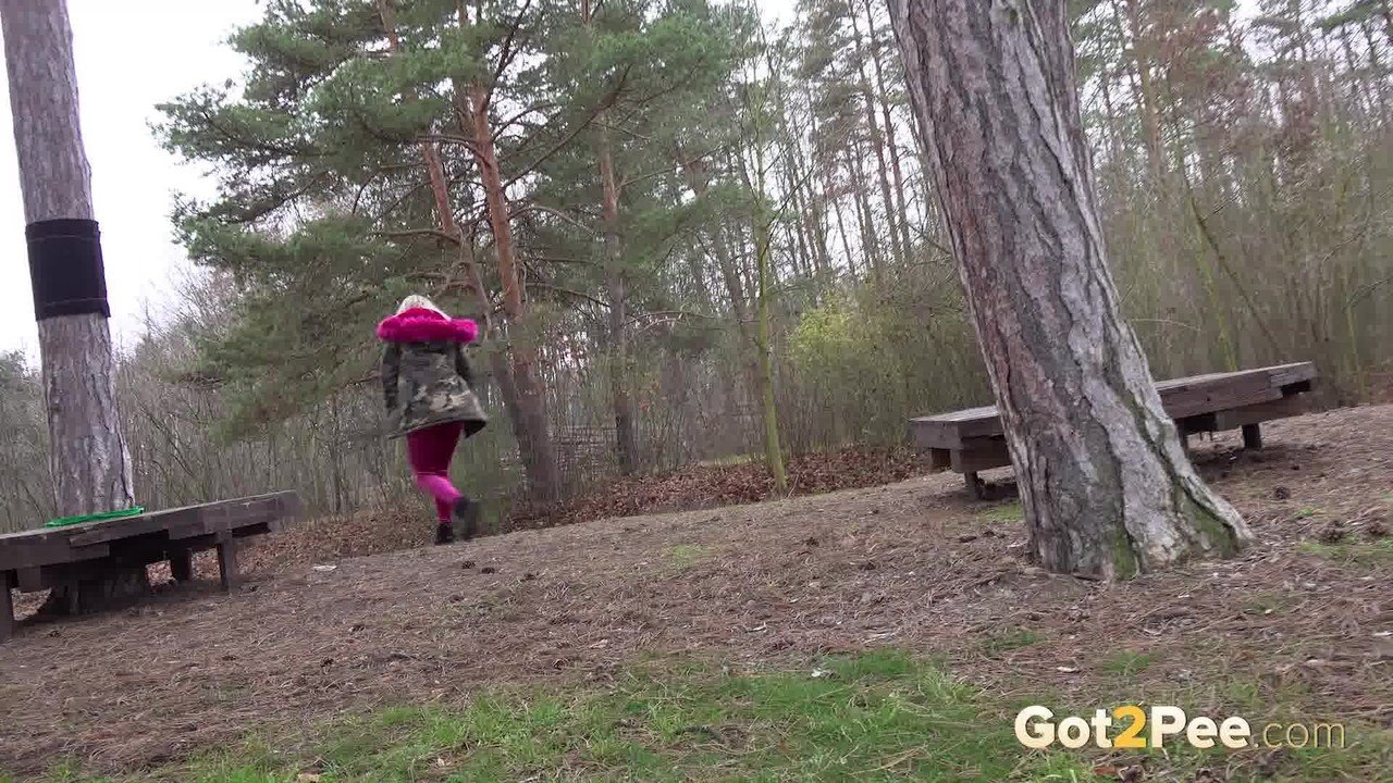 Long haired blonde makes a mess during outdoor pee
