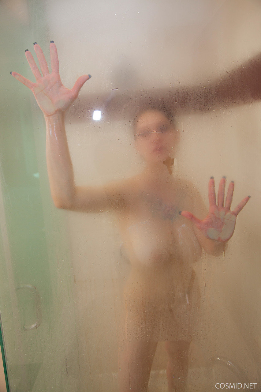 Big titted amateur Jennique gets caught bare naked while in the shower