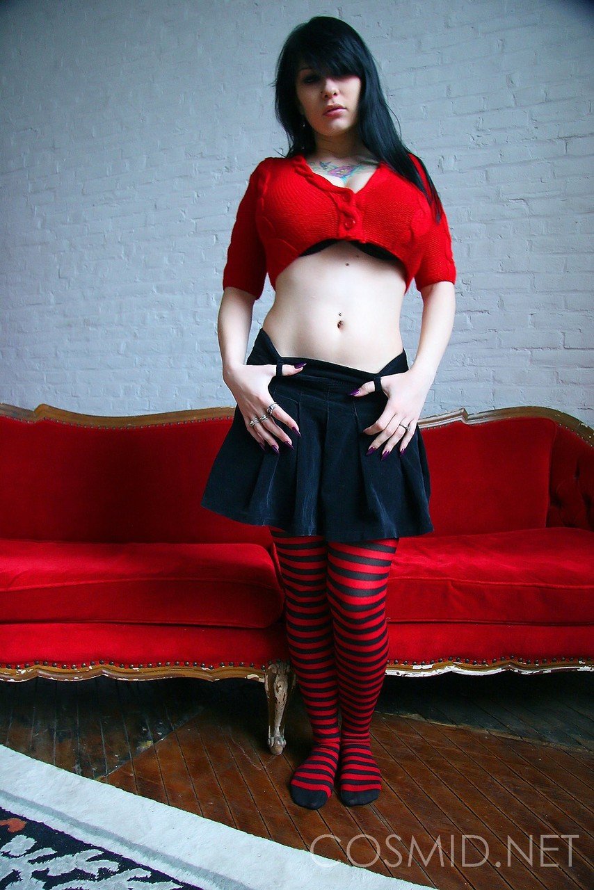 Goth girl Jennique looses her big breasts from a bra in striped OTK socks