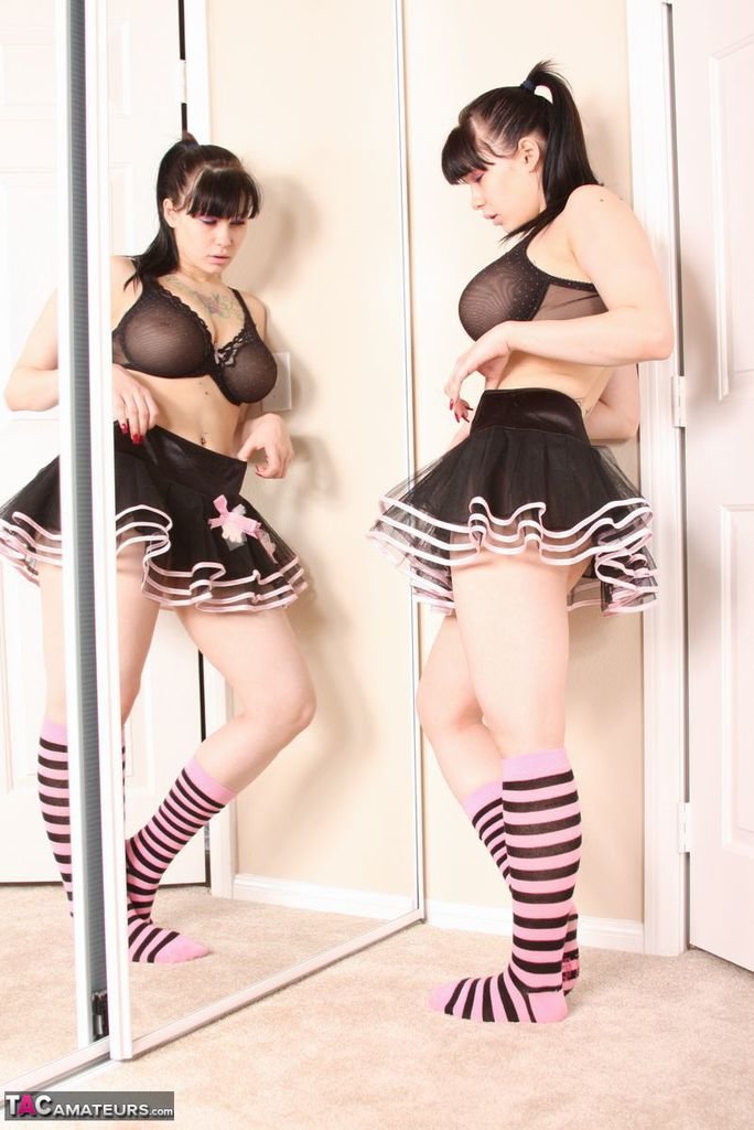 Busty amateur Susy Rocks models non nude afore mirror in skirt and socks