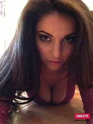 Charlotte Springer wearing tight pink see-through bodysuit in self-shot photoset