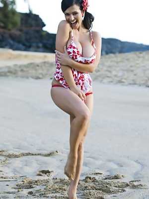 Denise Milani posing in sexy red & white dress and red thong on beach