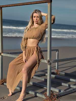 Stunning Katya exposes her big breasts on the beach