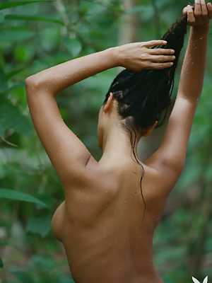 Geena Rocero posing nude in the rain forest and beach