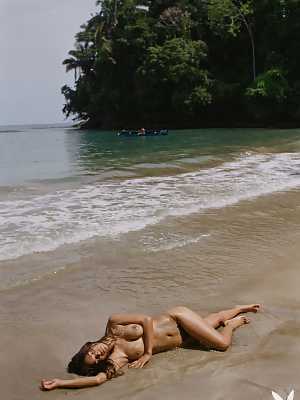 Geena Rocero posing nude in the rain forest and beach