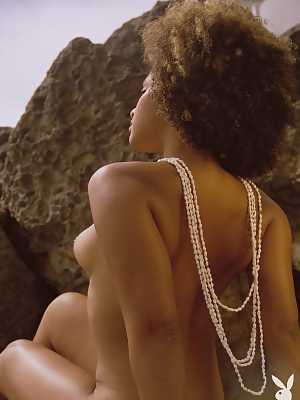 Chocolate beauty Gillian Chan is nude on the beach