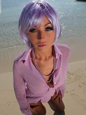 Holly only wearing purple on lonely beach