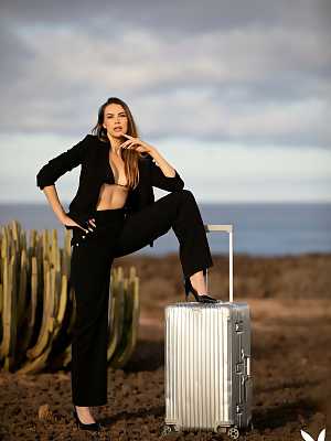 Jasmin gets out of her clothes and poses naked outdoors on top of a metal suitcase