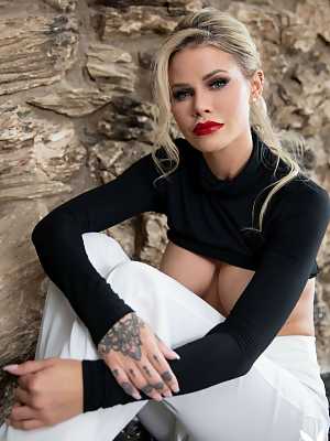 Jessa Rhodes exposes her large breasts and ass wearing a black pullover only