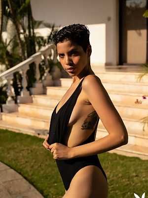 Tattooed babe Alejandra La Torre feels great without her black swimsuit