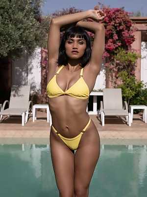 Angel Constance goes into the pool without her yellow bikini