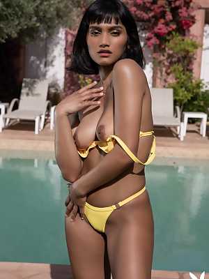 Angel Constance goes into the pool without her yellow bikini