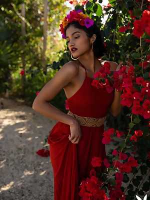 Angel Constance takes her red dress outside of her villa