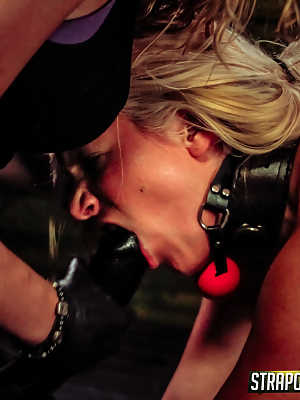 Young blonde Layla Price endures a lesbian BDSM session in cuffs and chains