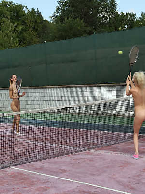 Young lesbians Adelle Unicorn & Kiara Cole share a dildo after a tennis match