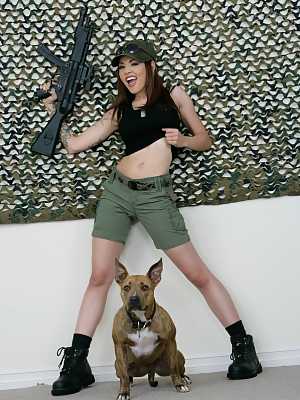 Sexy military MILF Adrenalynn shows her fakes & poses with an assault rifle