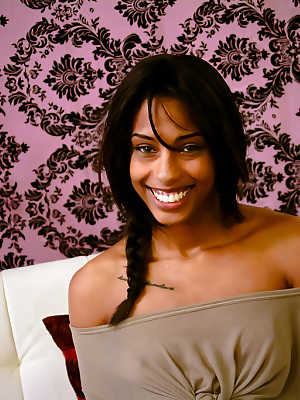 Smiley ebony floosie with pigtail uncovering her tiny titties