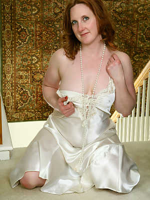 30 plus redhead Aella Rae slips out of satin negligee for her first nudes