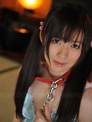 Japanese girl Ai Uehara wears her hair in pigtails in a collar and leash