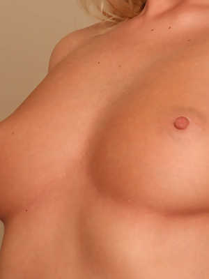 Blonde amateur with a tattooed navel A J Bailey showcases her trimmed muff