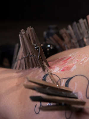 Durable slave Akira Raine endures clamps, cattle prod and hot wax treatment