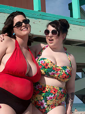 Mature BBW besties take out their massive big tits to play at the beach