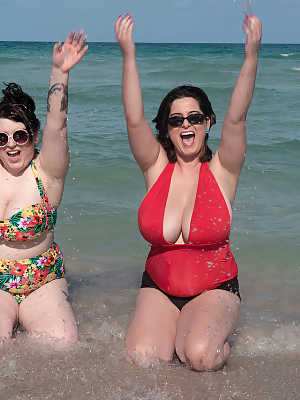 Mature BBW besties take out their massive big tits to play at the beach