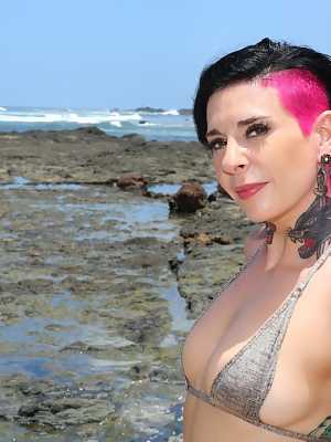 Tattooed pornstar Joanna Angel peels her bikini with her hot pals on the beach