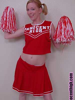 Pigtailed cheerleader Alexa Lynn flashes tiny natural tits and panties