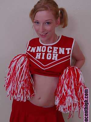 Pigtailed cheerleader Alexa Lynn flashes tiny natural tits and panties