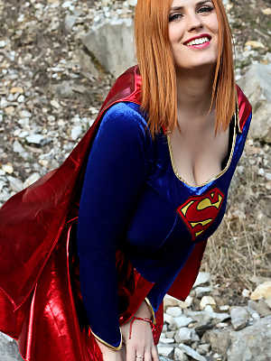 Thick redhead Alexsis Faye releases her giant tits from Superman osutfit