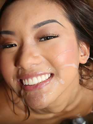 Young Asian girl Alina Li gets jizz on her face after giving a handjob
