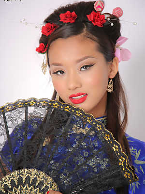 Stunning young Asian Alina Li doffs traditional garb to model her svelte body