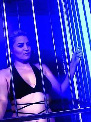 Blonde pornstar Alix Lovell	teases with her big tits & ass in a metal cage