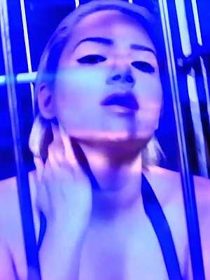 Blonde pornstar Alix Lovell	teases with her big tits & ass in a metal cage