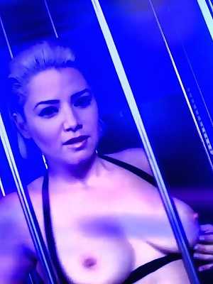 Blonde pornstar Alix Lovell	teases with her big tits & ass in a metal cage