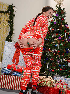 Adorable teen in Christmas pajamas Allie Haze reveals her anus with a buttplug